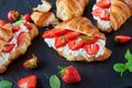 French croissant sandwiches with ripe strawberries Royalty Free Stock Photo