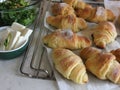 Freshly baked croissants with herb salad and cottage cheese.