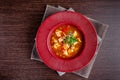 French cuisine concept. Classic French fish soup of seafood, shrimps, mussels, squid, potatoes, tomatoes Royalty Free Stock Photo
