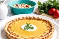 French cuisine. Cottage cheese tart with thyme in a white ceramic baking dish.Creamy soup. Creamy pumpkin pie. Generative AI