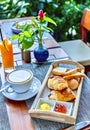 French cuisine. Gourmet meal. Traditional French breakfast - croissants, baguettes, and latte coffee. Royalty Free Stock Photo