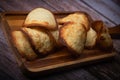 French delicacy pastry tuile with almond on wood background