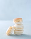French dessert Stack Macaron shells ready to be filled over light background, copy space. Cooking, food and baking concept