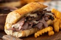 French dip sandwich and bowl of au jus