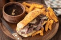 French dip sandwich and bowl of au jus Royalty Free Stock Photo