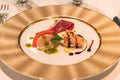 French dish hors d`oeuvre on a golden plate. Royalty Free Stock Photo