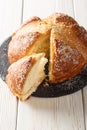 French Easter brioche mouna bread close-up in a plate. Vertical Royalty Free Stock Photo