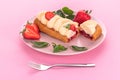 French eclair grazed with chocolate and fruity strawberry cream or sweet Italian profiteroles and fresh juicy strawberries, food