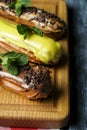 French eclairs with choclate top and different fillings. Traditional recipe, French cuisine.