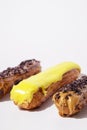 French eclairs with choclate top and different fillings. Traditional recipe, French cuisine.