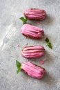 French eclairs with fruit pink glaze