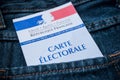 French electoral card in blue jeans pocket