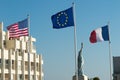 French, European and American Flags under blue sky Royalty Free Stock Photo