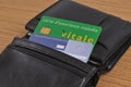 Vitale card and European health insurance card in a wallet on a wooden background