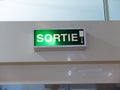 French exit ÃÂ«SortieÃÂ» light panel with direction indicator