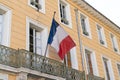 French facade building with the national flags of France Royalty Free Stock Photo