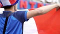 French fan holding national flag to support national team, competitive spirit