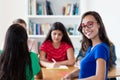 French female student learning with group of students Royalty Free Stock Photo