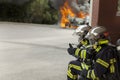 French firefighter binomial attac on car fire say ok Royalty Free Stock Photo