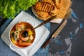 French fish soup Bouillabaisse with seafood, salmon fillet, shrimp, rich flavor, delicious dinner in a white beautiful plate. Copy Royalty Free Stock Photo