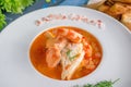French fish soup Bouillabaisse with seafood, salmon fillet, shrimp, rich flavor, delicious dinner in a white beautiful Royalty Free Stock Photo