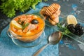 French fish soup Bouillabaisse with seafood, salmon fillet, shrimp, rich flavor, delicious dinner in a white beautiful plate. Clos Royalty Free Stock Photo