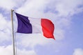 French flag of France wave over a blue cloud sky Royalty Free Stock Photo