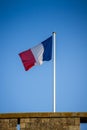 French flag on a pole floating in the wind Royalty Free Stock Photo