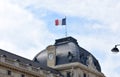 French flag on the top of the Ecole Militaire Military School. Champ de Mars, Paris, France. Royalty Free Stock Photo