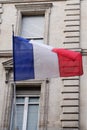 French flag waving in front of the facade of city hall france Royalty Free Stock Photo