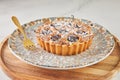 French Flair, cherry clafoutis presented on white marble with powdered sugar and fork Royalty Free Stock Photo