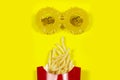 French fried potatoes face with yellow sunflower glasses Royalty Free Stock Photo