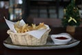 French fries in the basket and tomato sauce. Royalty Free Stock Photo
