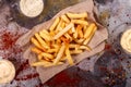 French fries chips potato and sauces on black stone slate over rusty background. top view Royalty Free Stock Photo