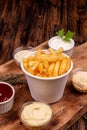 French fries chips potato and sauces on wooden background. top view Royalty Free Stock Photo