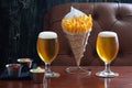 French Fries in Cone with Two Belgian Beers and Dipping Sauces Royalty Free Stock Photo