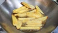 French fries cooking in pan second step is haft raw Royalty Free Stock Photo