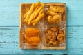 french fries and deep fried shrimps and chicken nuggets and popcorn chicken Royalty Free Stock Photo