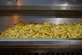 French fries in deep fryer at restaurant kitchen Royalty Free Stock Photo