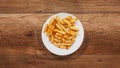 French fries disappear from a slowly rotating plate