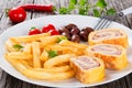 French fries on dish with baked cheese meat Roll-Ups Royalty Free Stock Photo