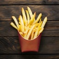 French fries displayed enticingly over a rustic wooden background Royalty Free Stock Photo