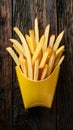 French fries displayed enticingly over a rustic wooden background Royalty Free Stock Photo