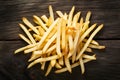 French fries displayed enticingly over a rustic wooden background Royalty Free Stock Photo