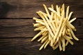 French fries displayed enticingly over a rustic wooden background Royalty Free Stock Photo