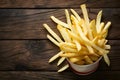 French fries displayed enticingly over a rustic wooden background Royalty Free Stock Photo