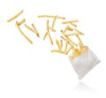 French fries flying out of paper packaging on white background Royalty Free Stock Photo