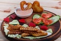 French fries and fresh vegetables chopped in the shape of a heart. Royalty Free Stock Photo