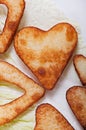 French fries and fresh vegetables chopped in the shape of a heart. Royalty Free Stock Photo