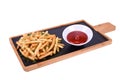 French fries with herbs and ketchup on a wooden board isolated on a white background Royalty Free Stock Photo